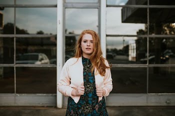 woman holding her jacket