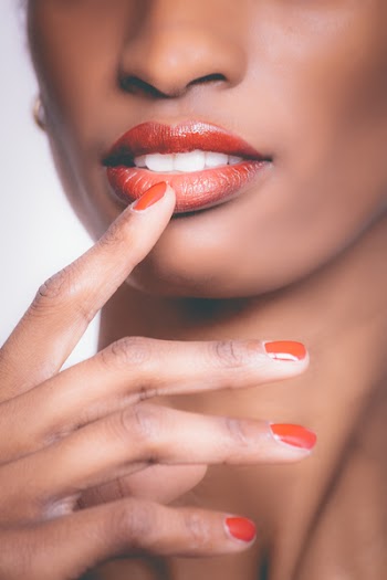 Woman Holding Her Lip