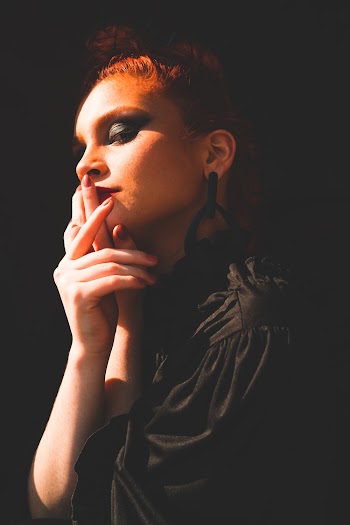 Woman Holding Her Lips