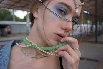 Woman Holding Her Necklace