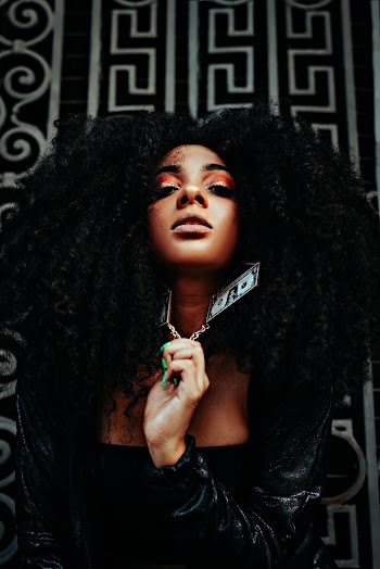 Woman Holding Her Necklace