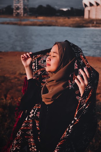 Woman Holding Her Scarf