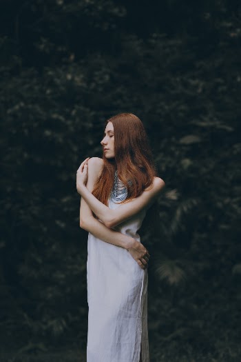 Woman Holding Her Shoulder