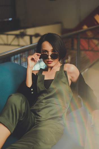 Woman Holding Her Sunglasses