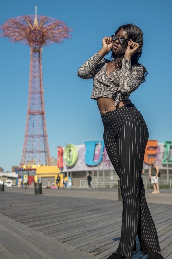Woman Holding Her Sunglasses