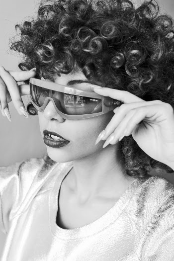 Woman Holding Her Sunglasses