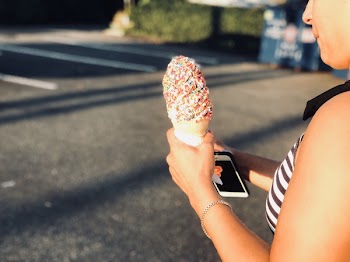 Woman Holding Ice Cream in Cone
