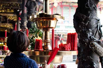 Woman Holding Incense Sticks