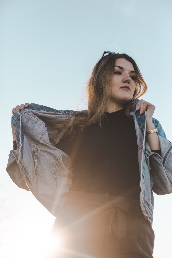 Woman Holding Jacket