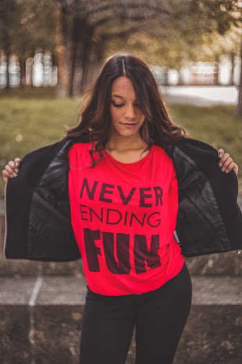 Woman Holding Jacket Looking Down