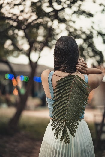 Woman Holding Leaf