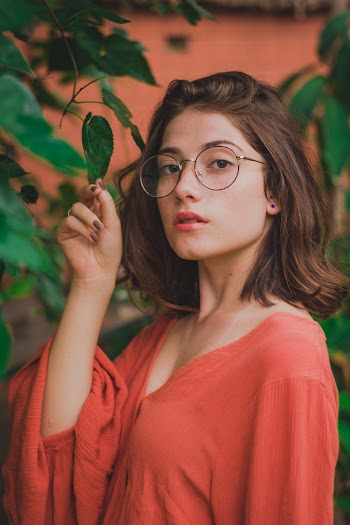 Woman Holding Leaf With Her Right Hand