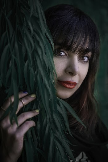 Woman Holding Leaves