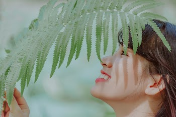 Woman Holding Leaves
