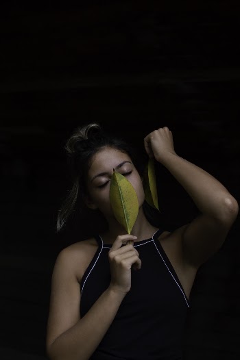 Woman Holding Leaves