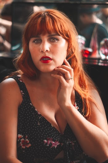 Woman Holding Left Cheek