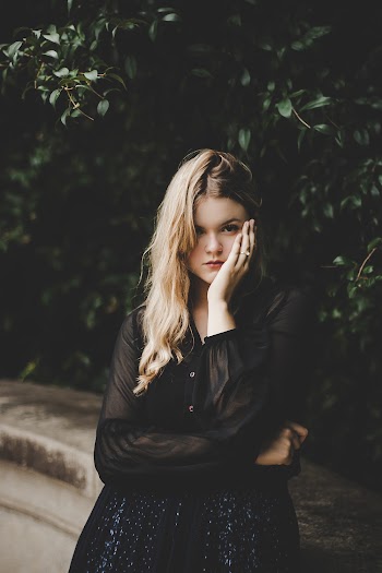 Woman Holding Left Cheek Photography