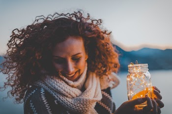 Woman Holding Lighted Jar