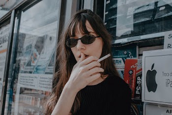 Woman Holding Lit Cigarette