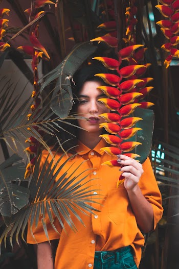 Woman Holding Lobster-claw Flower