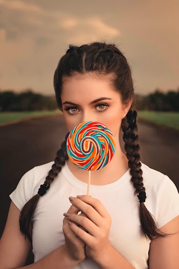 Woman Holding Lollipop