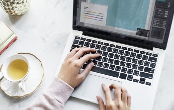 Woman Holding Macbook Pro