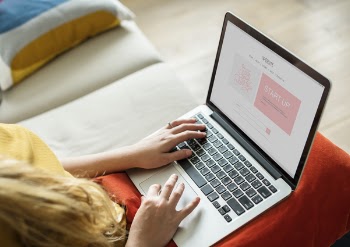 Woman Holding Macbook Pro