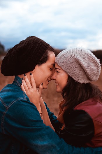 Woman Holding Man's Face