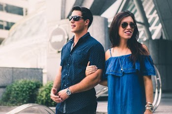 woman holding man's arm