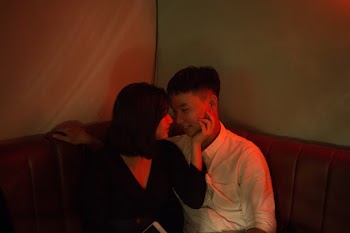 Woman Holding Mans Face