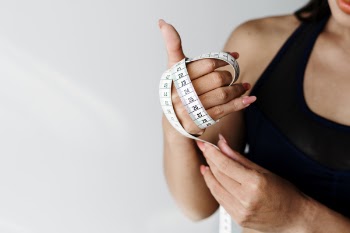 Woman Holding Measuring Tape