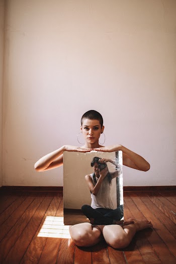 Woman Holding Mirror