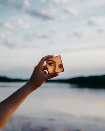 Woman Holding Mirror