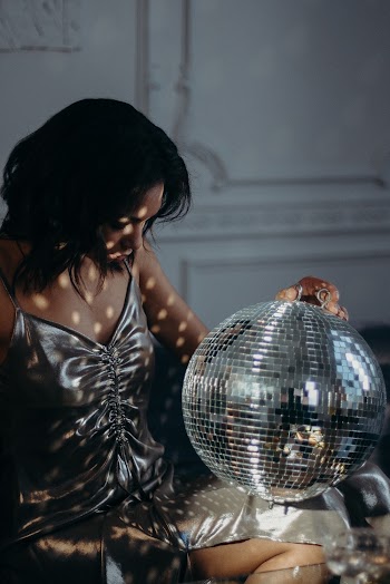 Woman Holding Mirror Ball
