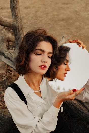 Woman Holding Mirror  · Free Stock Photo