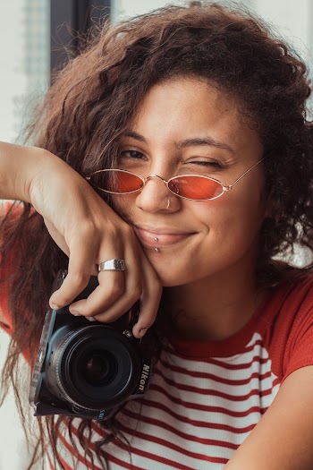 Woman Holding Nikon Camera