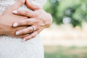 woman holding on her tummy