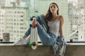 Woman Holding Penny Board