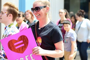 Woman Holding Pink Folder