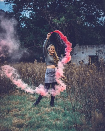Woman Holding Pink Smoke Bomb