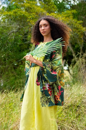 Woman Holding Plant Leaf