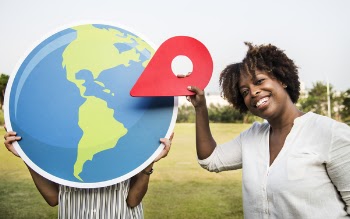 Woman Holding Plastic Arrow While Smiling