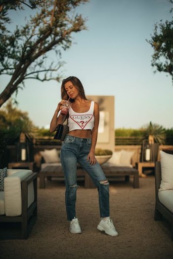 woman holding plastic cup
