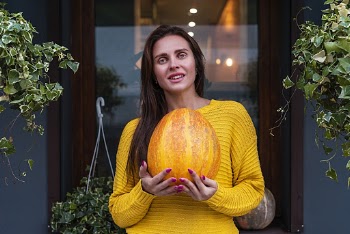Woman Holding Pumpkin