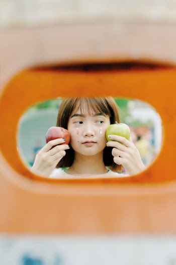 Woman Holding Red And Green Apples · Free Stock Photo