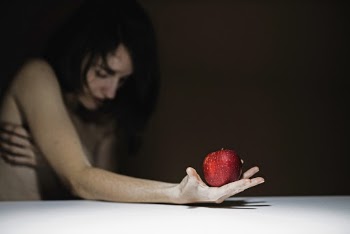 Woman Holding Red Apple