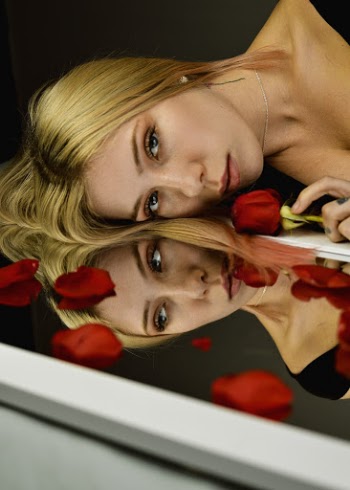Woman Holding Red Flower