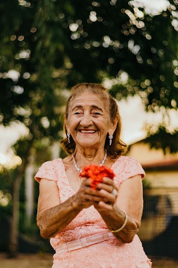 Woman Holding Red Flower