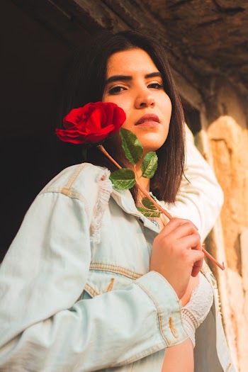 Woman Holding Red Flower