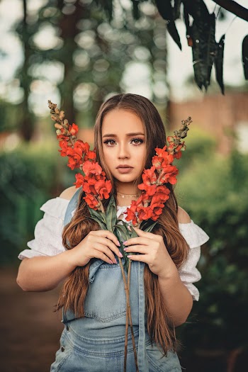 Woman Holding Red Flowers
